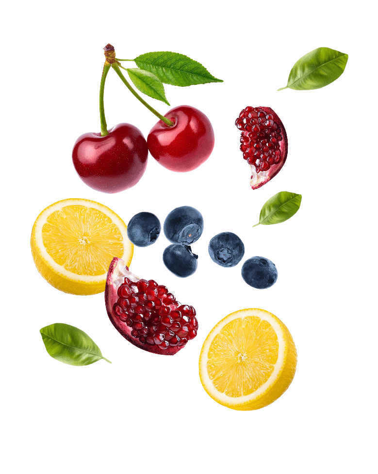 Fresh fruit ingredients including cherries, lemon, blueberries, and pomegranate